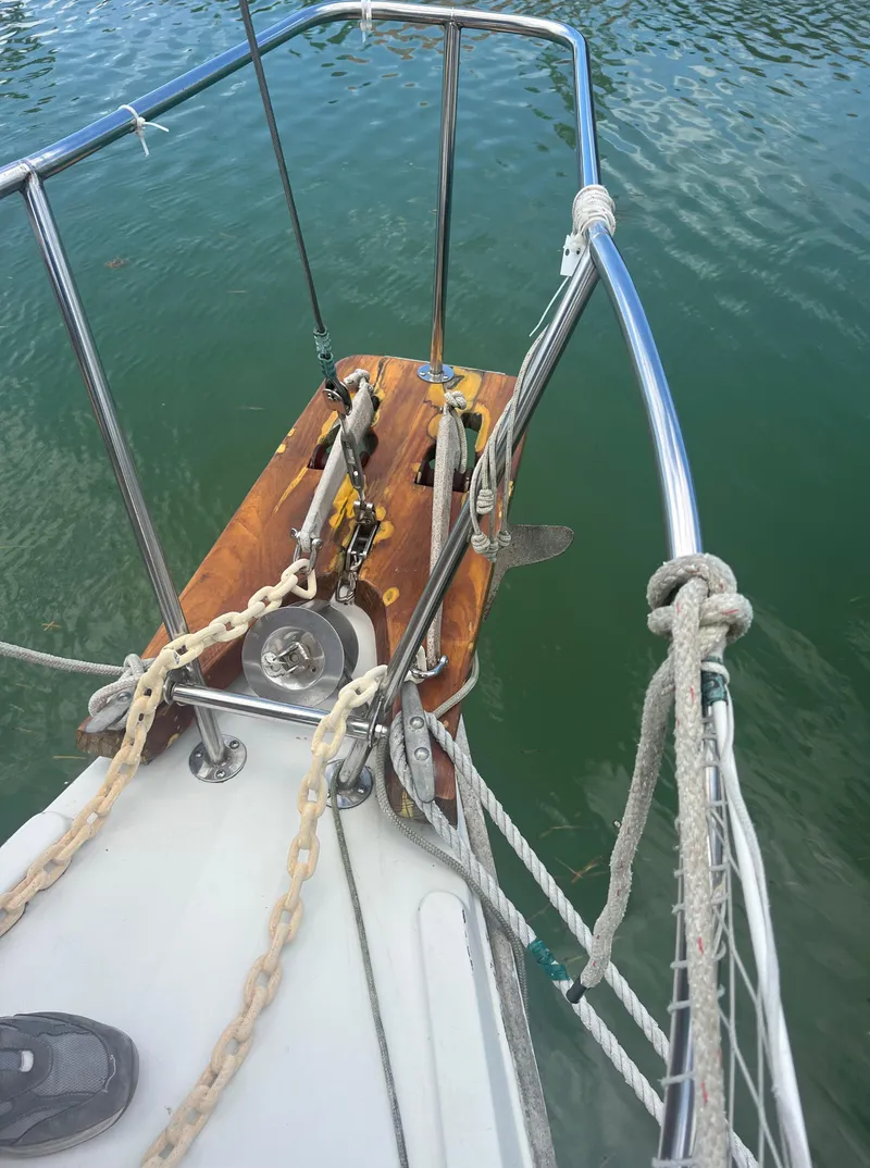 Slide: The Image of Bow of a 1974 CAL T2 sailboat with anchor and chain. - 11