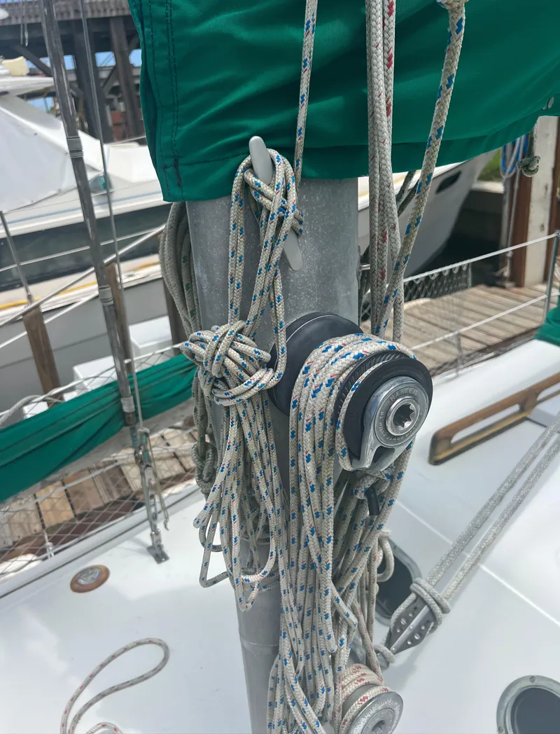 Slide: The Image of Sailboat rigging on a 1974 CAL T2 at a marina. - 14