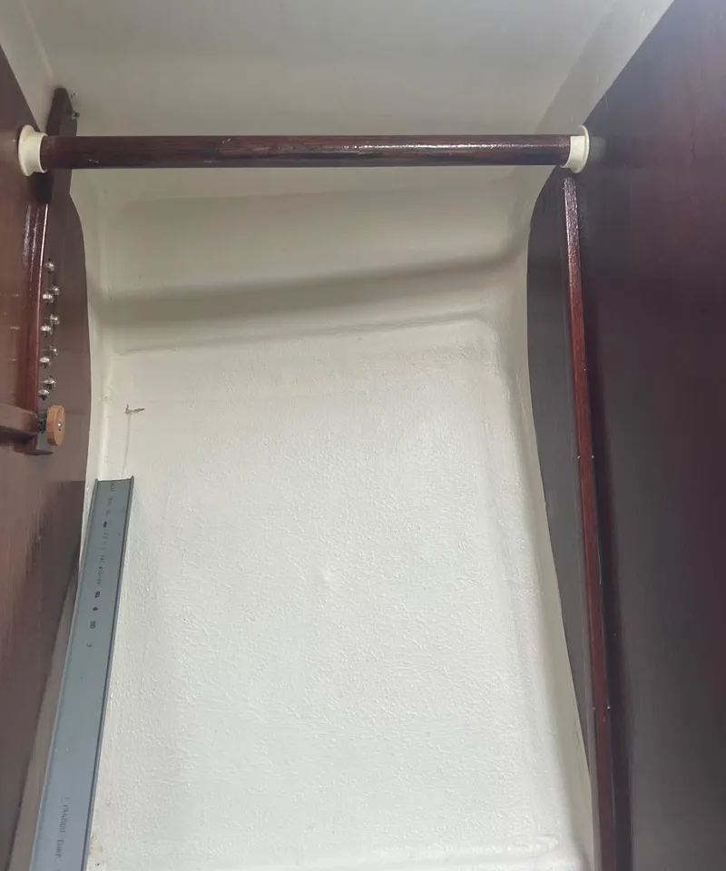 Slide: The Image of 1974 CAL T2 sailboat interior with wooden handrails. - 25