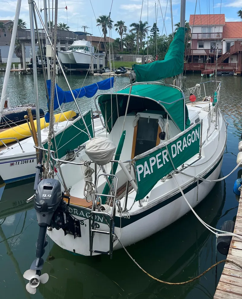 Slide: The Image of 1974 CAL T2 sailboat Paper Dragon docked in a marina. - 3