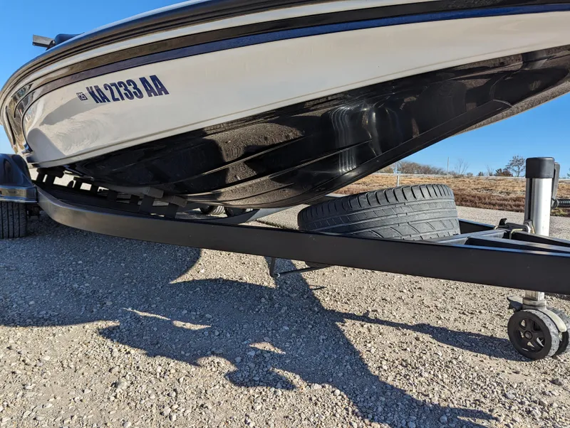 Slide: The Image of 2012 Nitro Z8 boat on a trailer, close-up view of the hull and tire. - 10