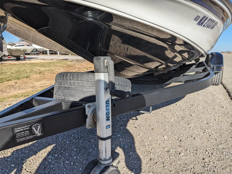 Slide: The Image of 2012 Nitro Z8 boat on trailer, close-up of hitch and wheel. - 11