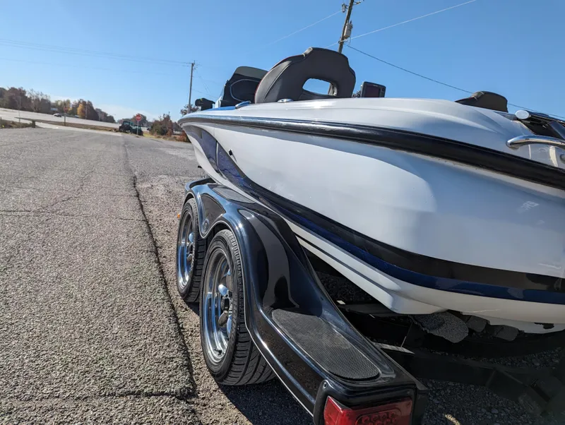Slide: The Image of 2012 Nitro Z8 boat on a trailer parked on a road. - 4