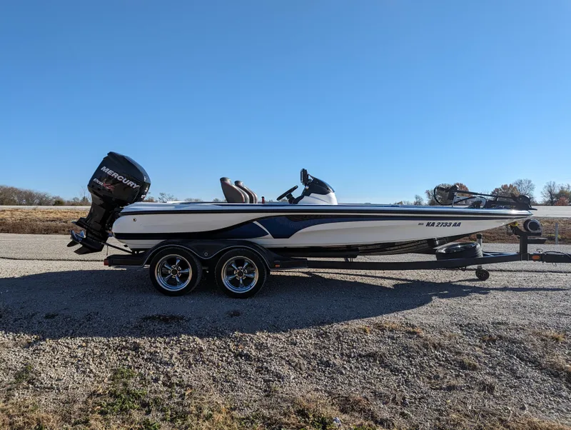 Slide: The Image of 2012 Nitro Z8 boat with Mercury outboard motor on a trailer. - 8