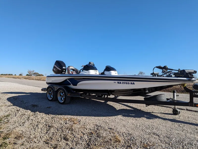 Slide: The Image of 2012 Nitro Z8 boat on a trailer under a clear blue sky. - 9