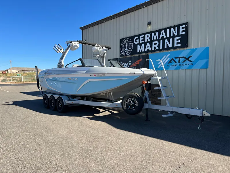 Slide: The Image of 2021 Tigé 25ZX boat on trailer at Germaine Marine dealership. - 0