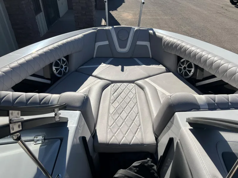 Slide: The Image of 2021 Tigé 25ZX boat interior with luxurious seating and built-in speakers. - 6