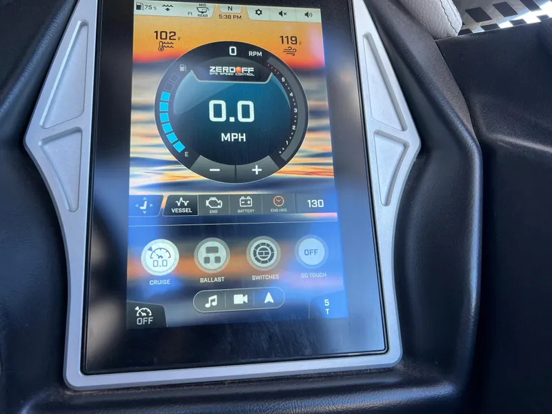 Slide: The Image of 2021 Tigé 25ZX touchscreen dashboard display showing speed and control settings. - 8