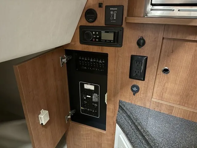 Slide: The Image of Interior view of 2014 Cruisers Yachts 275 Express with control panel. - 24