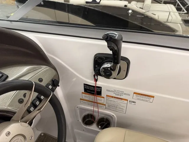 Slide: The Image of 2014 Cruisers Yachts 275 Express helm with throttle control. - 30