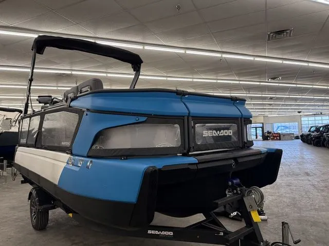 Slide: The Image of 2023 Sea-Doo Switch Cruise 21 in a showroom. - 2