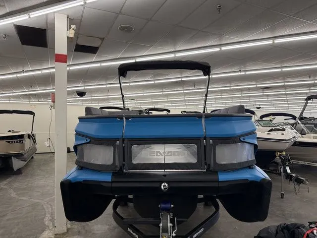 Slide: The Image of 2023 Sea-Doo Switch Cruise 21 in a showroom. - 3