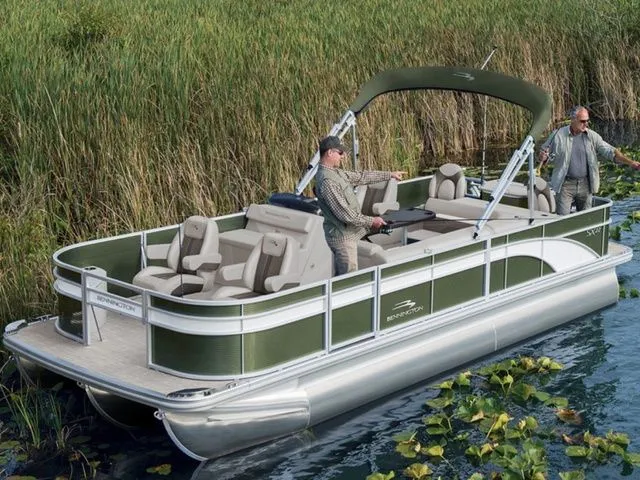 The Image of 2021 Bennington 21 SSNPXAPG pontoon boat on a serene lake. - 1