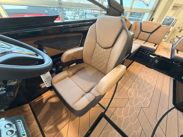 Slide: The Image of 2025 Yamaha Boats 255XD interior with luxurious seating and modern design. - 14
