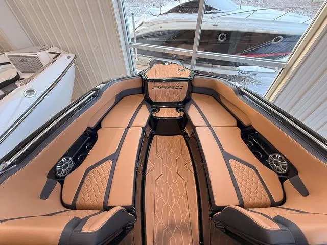 Slide: The Image of 2025 Yamaha Boats 255XD interior with luxurious tan seating and modern design. - 22