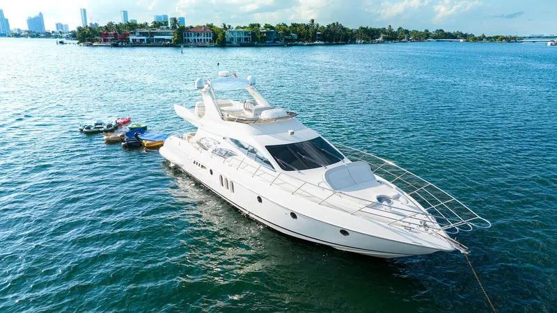 Slide: The Image of Luxurious 2005 Azimut 62 Evolution yacht anchored in serene waters. - 1