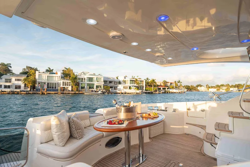 Slide: The Image of Luxurious 2005 Azimut 62 Evolution yacht with elegant deck and waterfront view. - 12