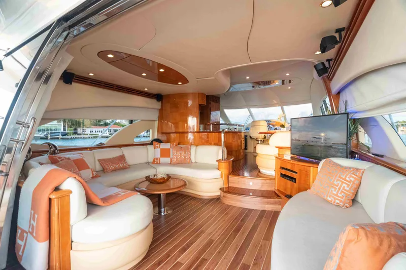 Slide: The Image of Luxurious interior of 2005 Azimut 62 Evolution yacht with elegant seating and wood finishes. - 15