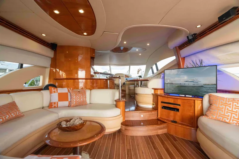 Slide: The Image of Luxurious interior of a 2005 Azimut 62 Evolution yacht with elegant seating and modern amenities. - 17