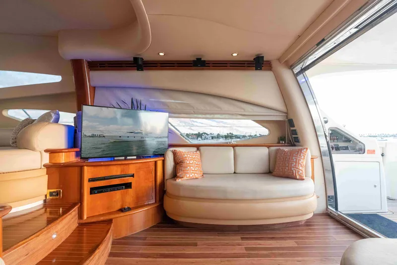 Slide: The Image of Luxurious interior of 2005 Azimut 62 Evolution yacht with elegant seating and TV. - 18