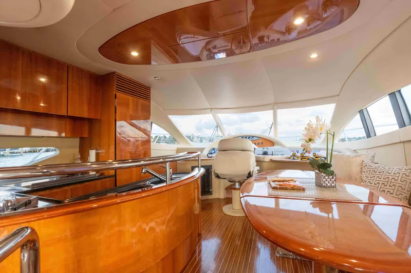 Slide: The Image of Luxurious interior of 2005 Azimut 62 Evolution yacht with polished wood finishes. - 19