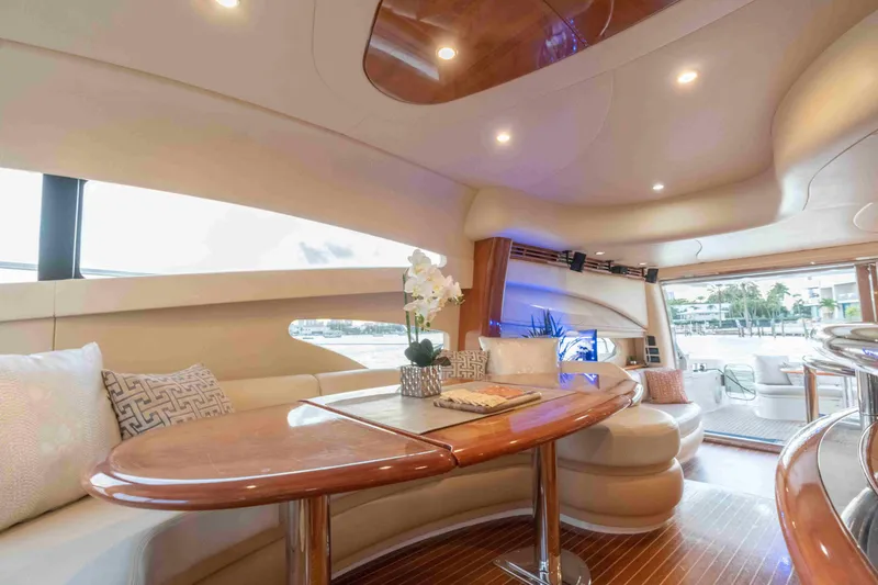 Slide: The Image of Luxurious interior of 2005 Azimut 62 Evolution yacht with elegant seating and wooden accents. - 20