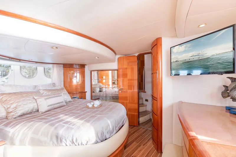 Slide: The Image of Luxurious interior of 2005 Azimut 62 Evolution yacht with elegant bedroom and modern amenities. - 23