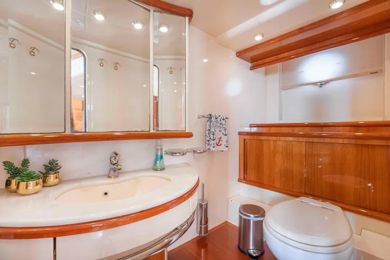 Slide: The Image of Luxurious bathroom in 2005 Azimut 62 Evolution yacht with elegant wood accents. - 25
