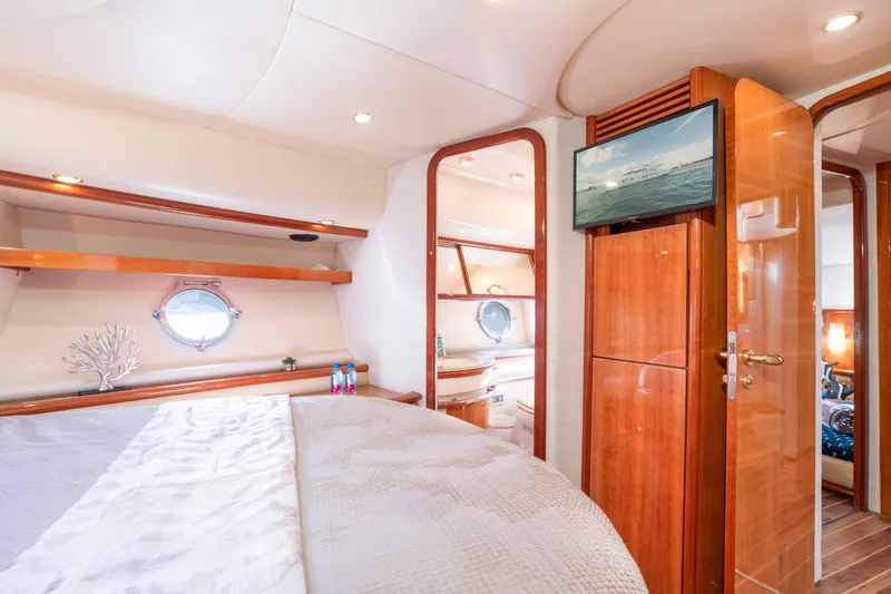 Slide: The Image of Luxurious cabin interior of 2005 Azimut 62 Evolution yacht with elegant wood finishes. - 28