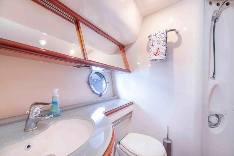 Slide: The Image of Luxurious bathroom in 2005 Azimut 62 Evolution yacht, featuring elegant fixtures and nautical decor. - 29