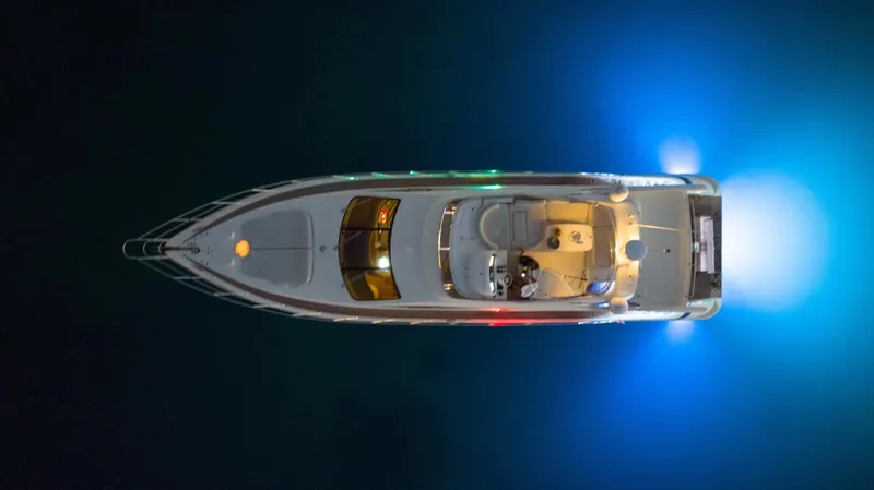 Slide: The Image of Aerial view of 2005 Azimut 62 Evolution yacht illuminated at night. - 35
