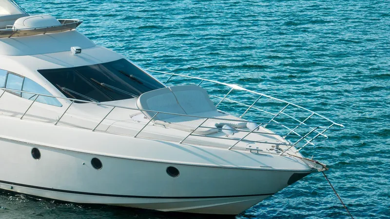 Slide: The Image of Luxury 2005 Azimut 62 Evolution yacht on serene blue waters. - 4
