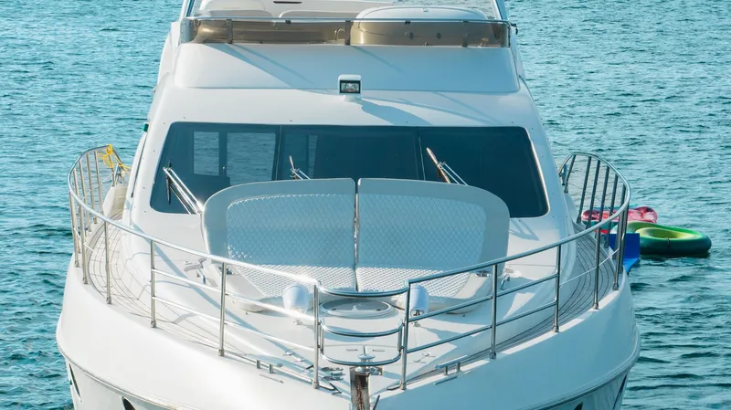 Slide: The Image of Front view of 2005 Azimut 62 Evolution yacht on water. - 5