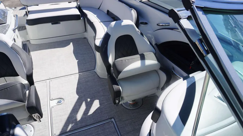 Slide: The Image of Interior of 2024 Crownline E 290 XS boat with luxurious seating and modern design. - 12