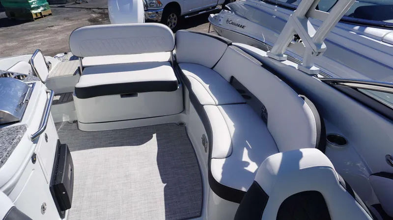 Slide: The Image of Interior seating of 2024 Crownline E 290 XS boat with white and black upholstery. - 14