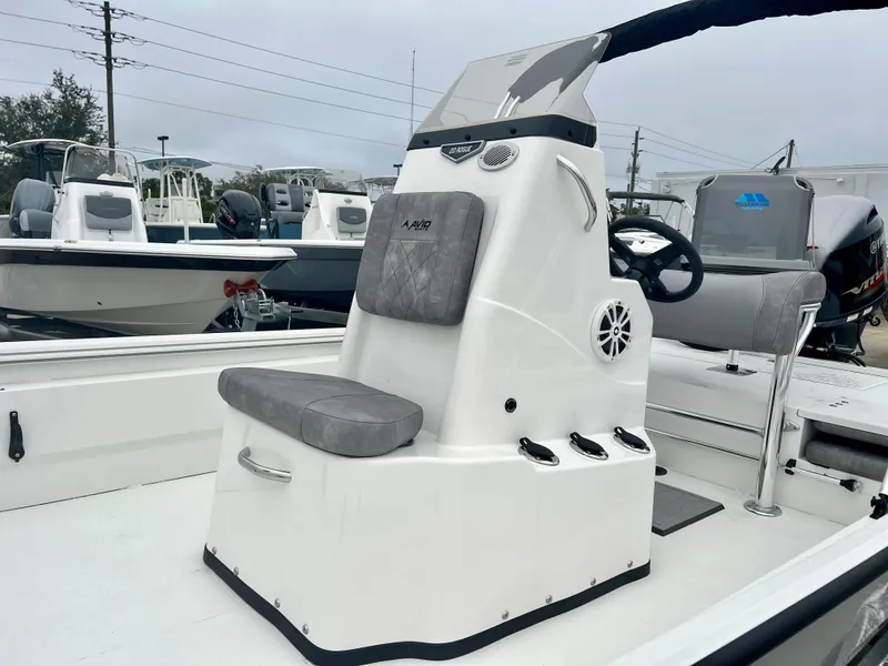 Slide: The Image of 2024 Avid 20 ROGUE CC boat console with seating and steering wheel. - 3