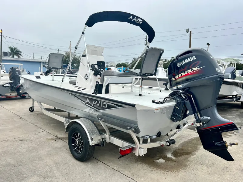 Slide: The Image of 2024 Avid 20 ROGUE CC boat with Yamaha outboard motor on trailer. - 8