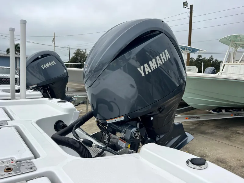 Slide: The Image of 2024 NauticStar 214 Bay boat with Yamaha outboard engines. - 5