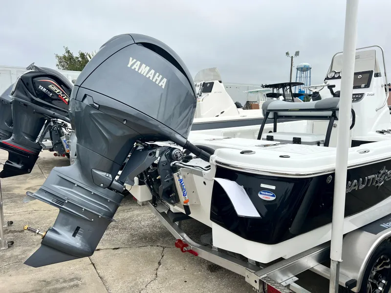 Slide: The Image of 2024 NauticStar 214 Bay boat with Yamaha outboard motor. - 7