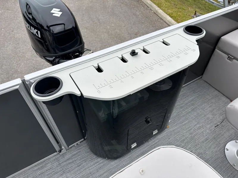 Slide: The Image of 2024 Sweetwater EX2286FX boat with Suzuki outboard motor and integrated fishing station. - 13