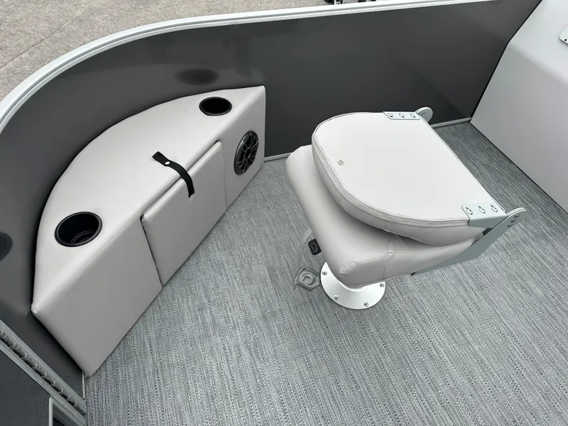 Slide: The Image of 2024 Sweetwater EX2286FX boat interior with gray seating and storage compartments. - 3