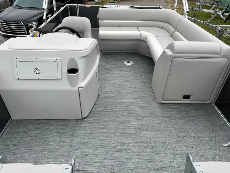 Slide: The Image of 2024 Sweetwater EX2286FX pontoon boat interior with gray seating and flooring. - 4
