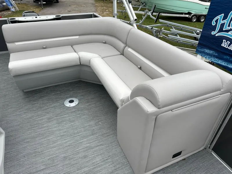 Slide: The Image of 2024 Sweetwater EX2286FX pontoon boat with spacious gray seating area. - 5