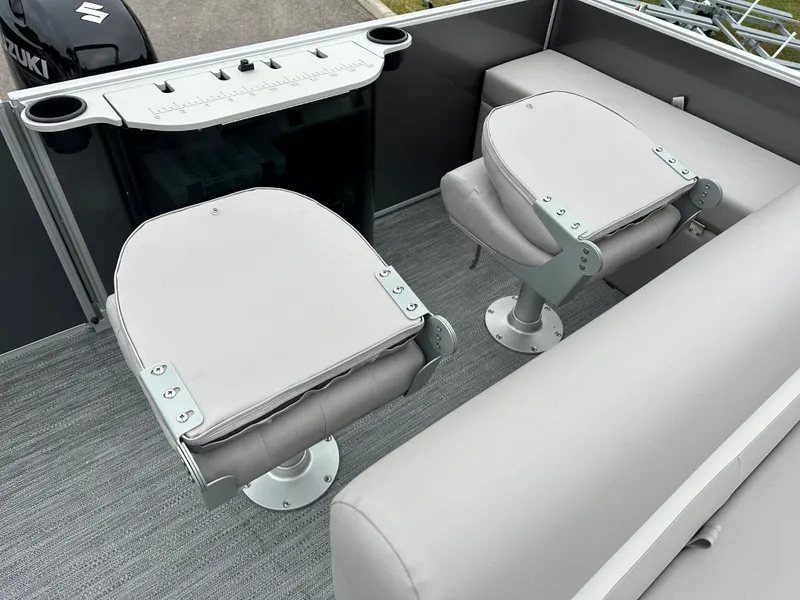 Slide: The Image of 2024 Sweetwater EX2286FX boat interior with swivel seats and control panel. - 8