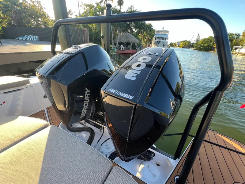 Slide: The Image of 2023 Axopar 37 Sun-Top with twin Mercury outboard engines on a sunny day. - 13