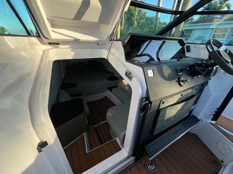 Slide: The Image of Interior cabin and helm of 2023 Axopar 37 Sun-Top boat with modern design. - 18