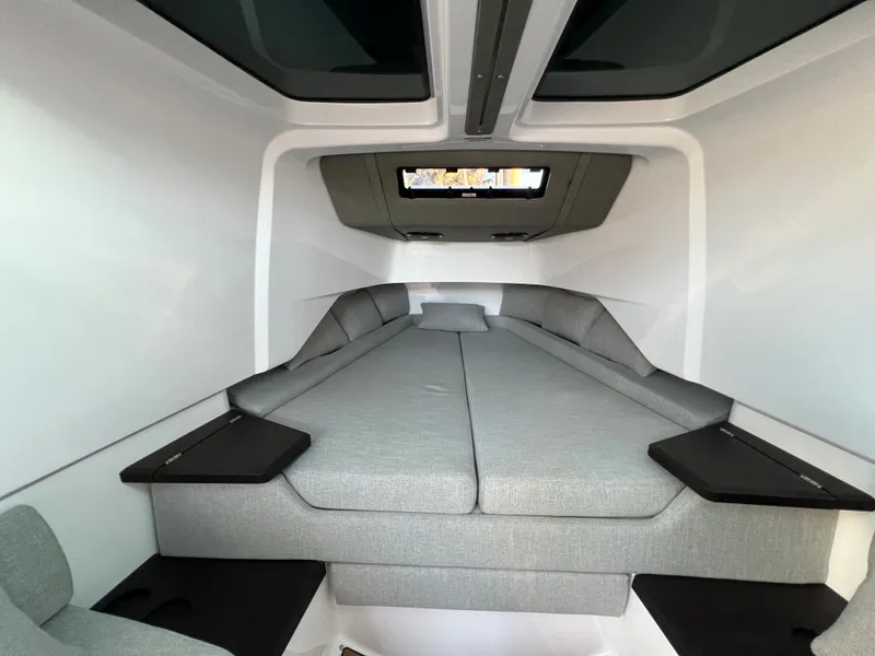 Slide: The Image of Interior cabin of 2023 Axopar 37 Sun-Top with modern grey seating. - 20