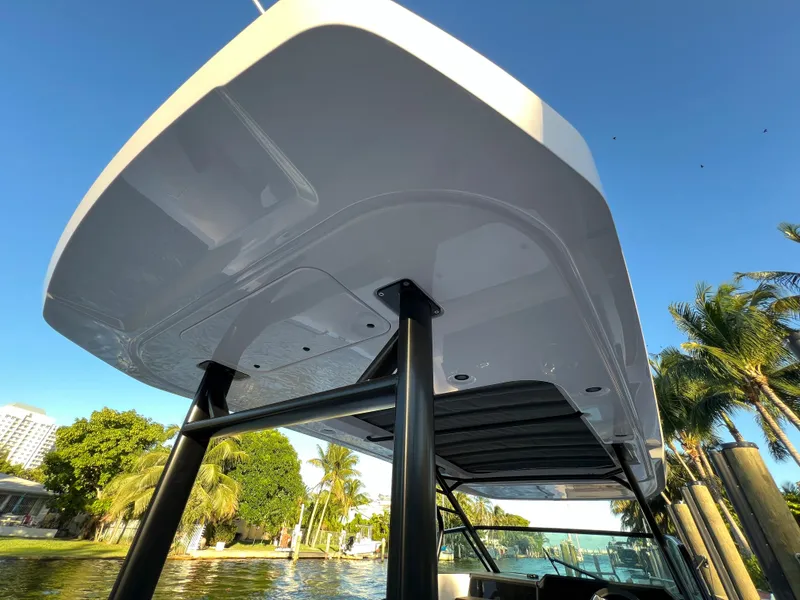 Slide: The Image of 2023 Axopar 37 Sun-Top boat, view of the sun-top roof and support structure. - 29