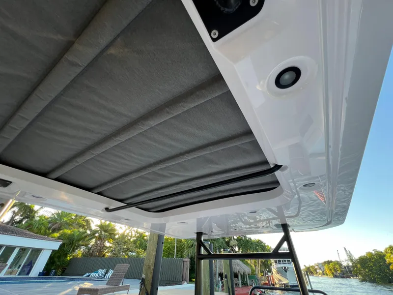 Slide: The Image of 2023 Axopar 37 Sun-Top boat canopy and roof detail. - 32