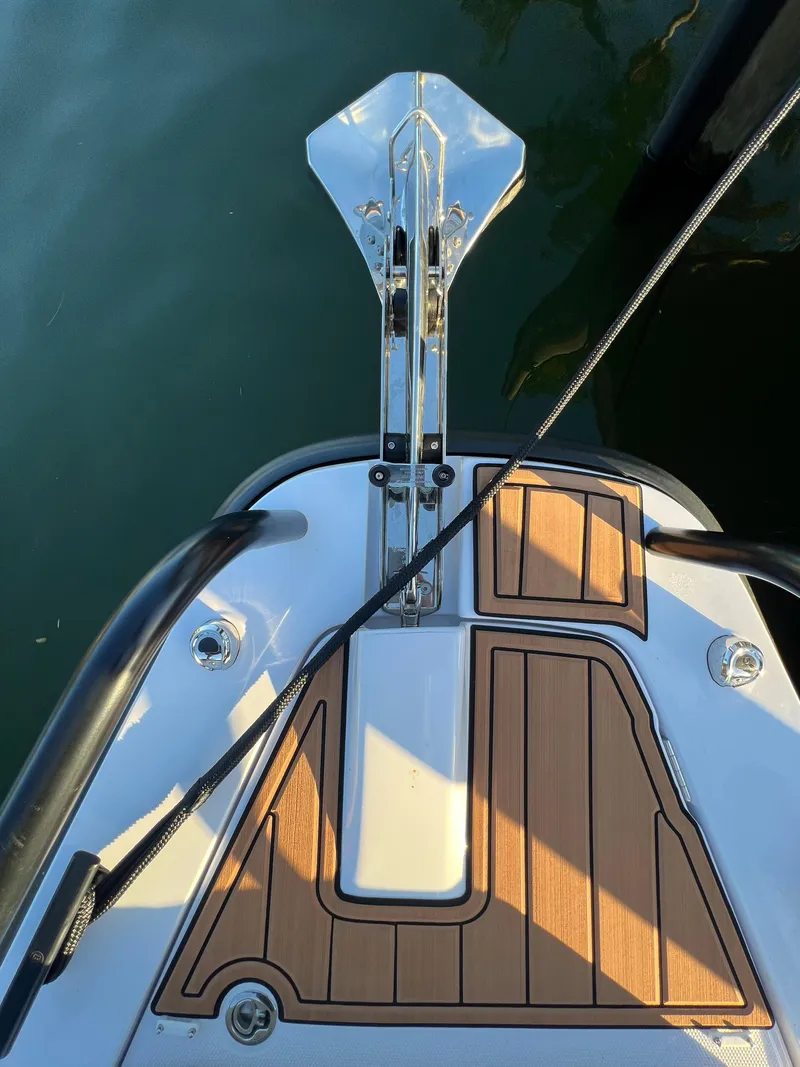 Slide: The Image of Bow of 2023 Axopar 37 Sun-Top with anchor and teak decking. - 37